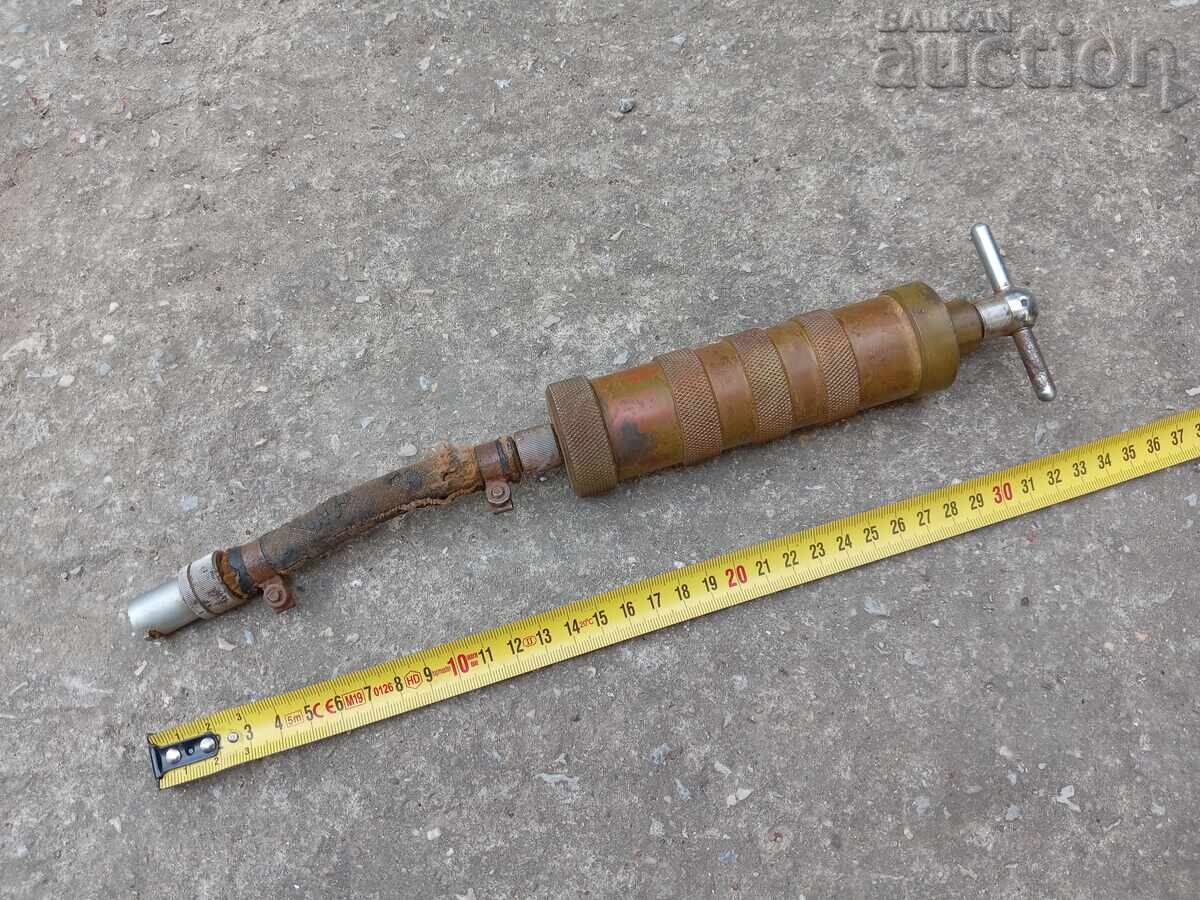 Grease gun, military type, armored vehicle