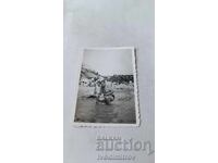 Imaginează Un bărbat și un băiețel pe plajă