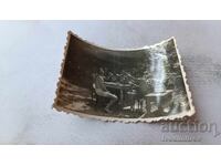 Photo of Young Men in Shorts Having Drinks