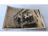 Photo of Four Men on Scaffolding at a Newly Built House