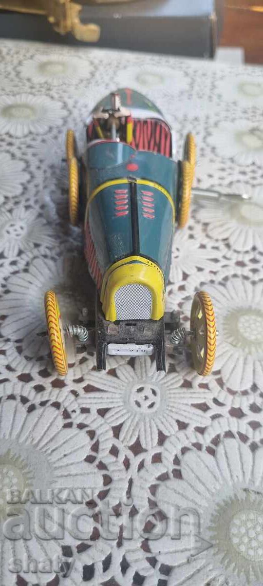 Auction  Tin toy