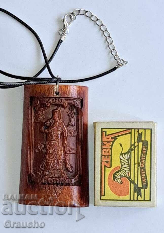 Amulet pendant made of bone for protection, compassion, and blessing