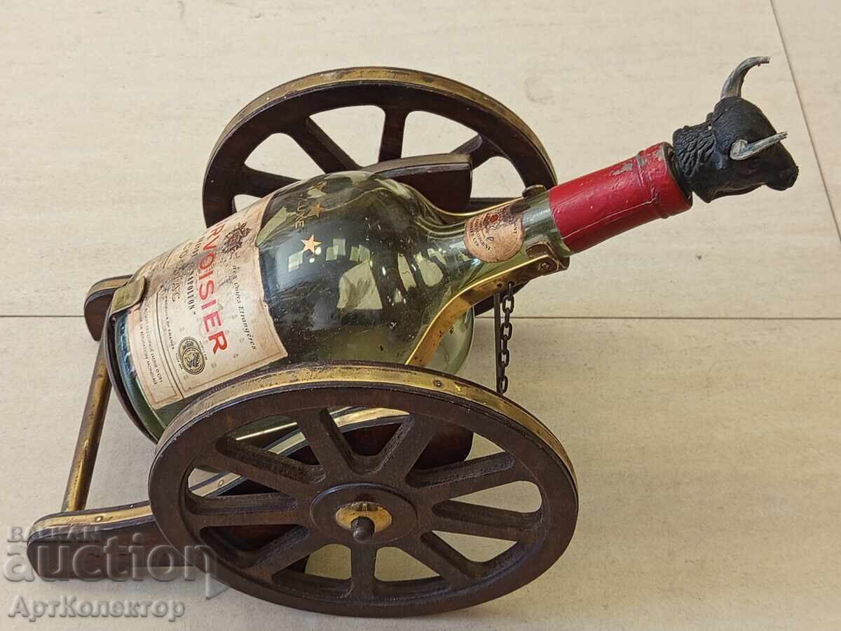 Delivery of Old cognac bottle on a wooden base with brass COURVOISIER