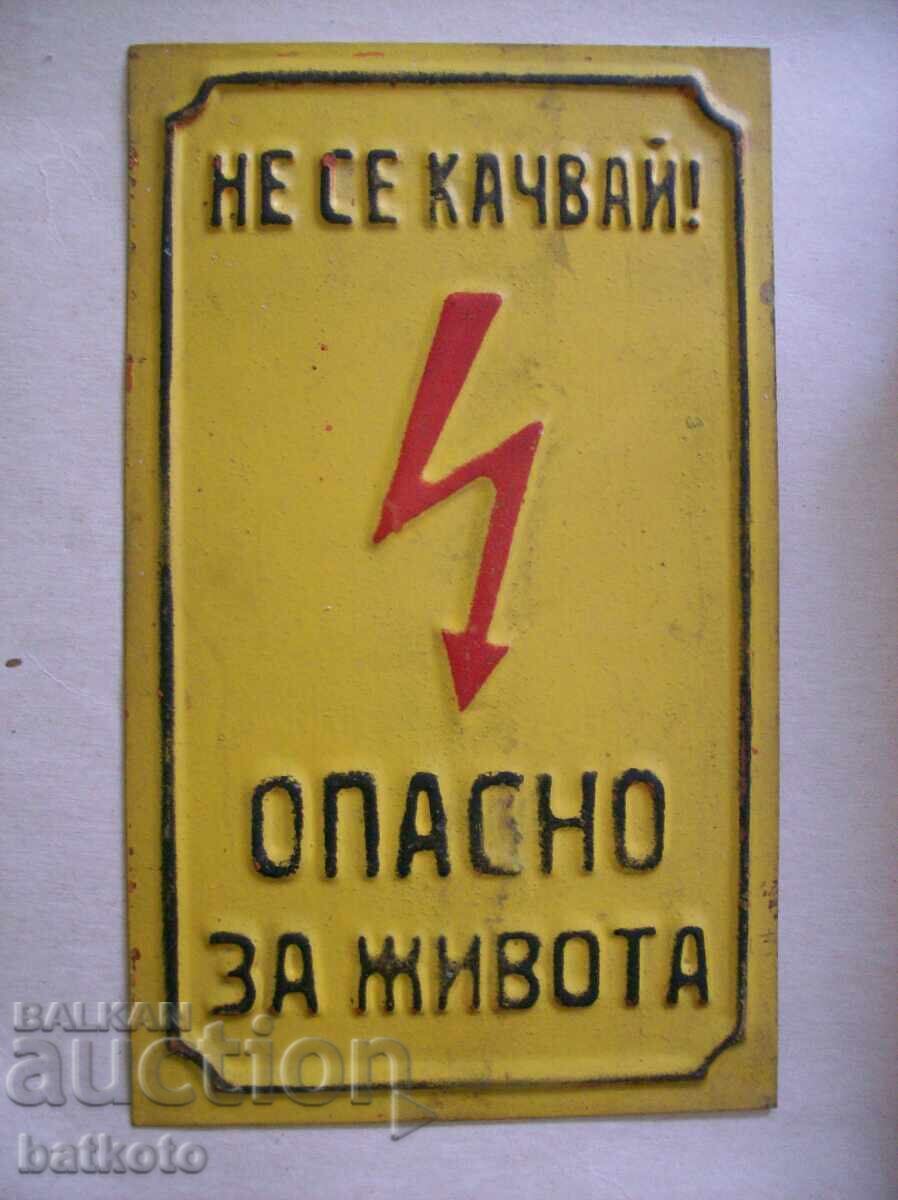 Old metal sign from the socialist era Old metal sign from the socialist era