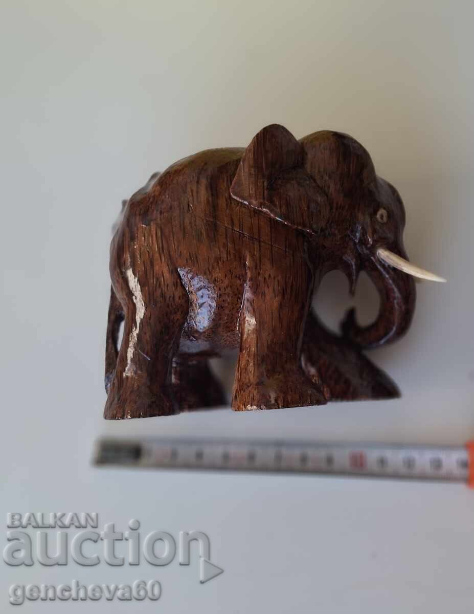 Auction  Hand-carved wooden elephant figure