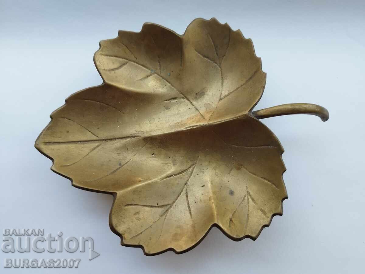 Old bronze stand, vine leaf Old bronze stand, vine leaf