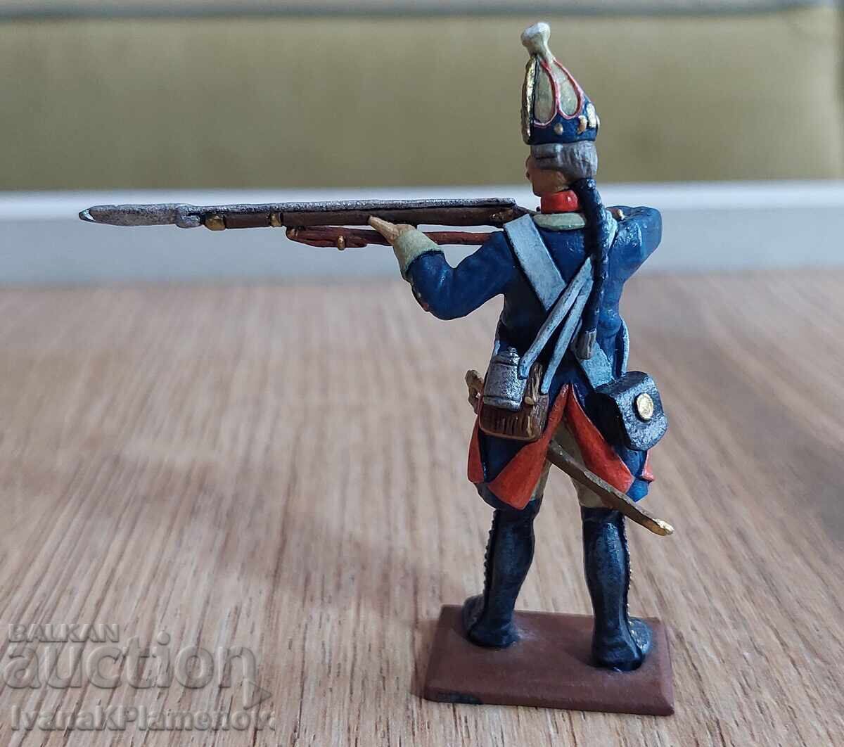 Livrarea O figurină de plumb pentru colecționari