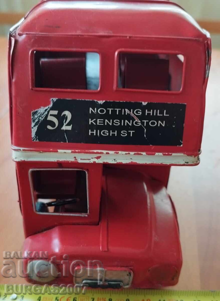 Delivery of Old tin toy, double-decker bus Delivery of Old tin toy, double-decker bus
