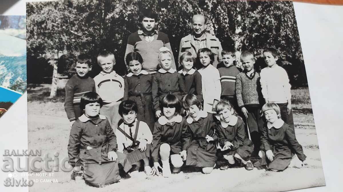 Photos of teachers with their students from the 70s