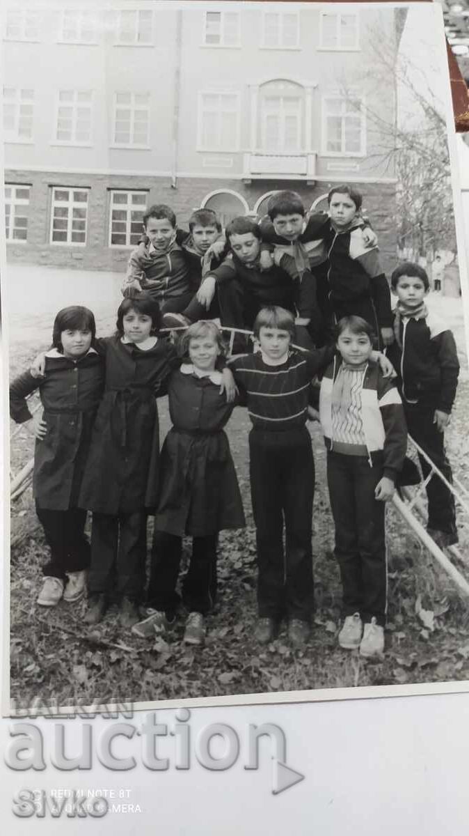 Photo of students in the schoolyard, 70s