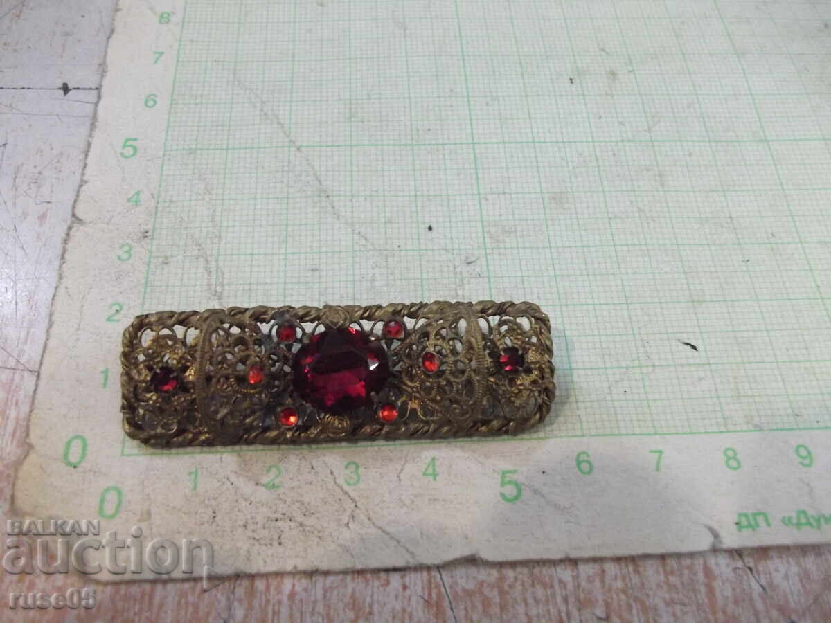 Filigree brooch, old metal, with red stones