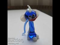 Statuetă de sticlă albastră, reprezentând o maimuță