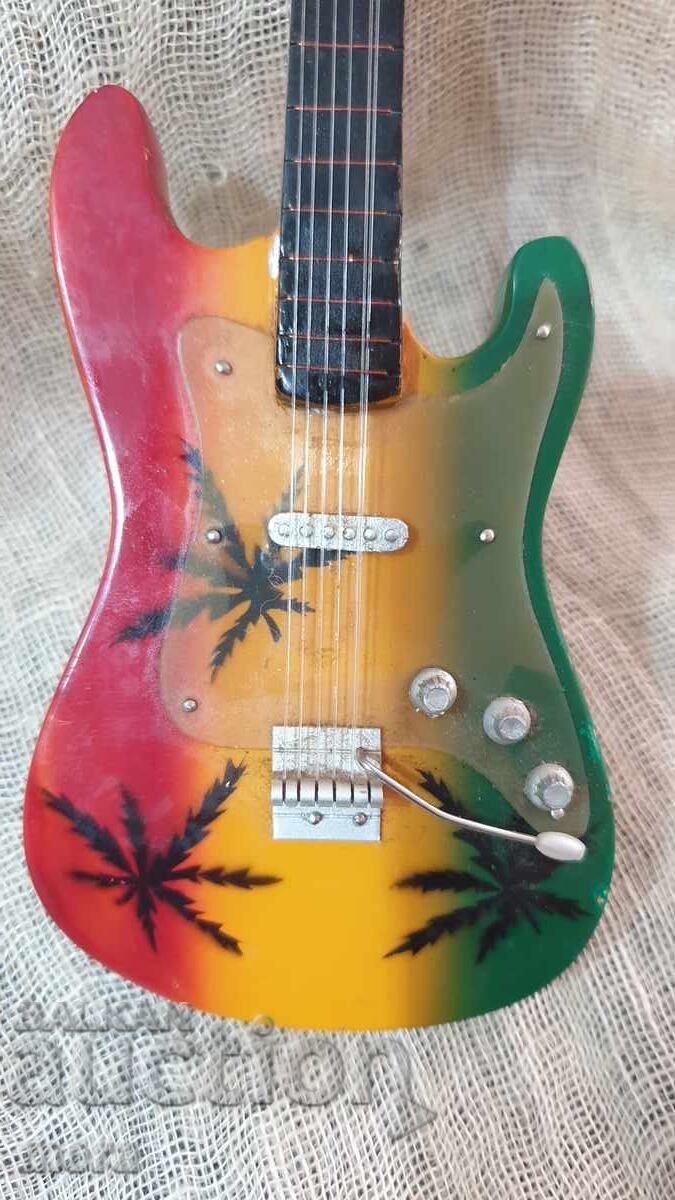 Delivery of Small souvenir guitar