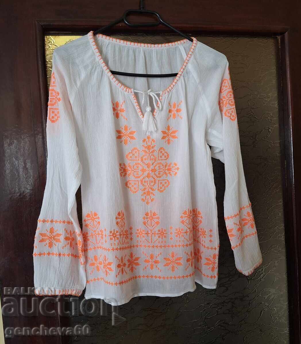 Richly embroidered blouse with long sleeves for a traditional costume