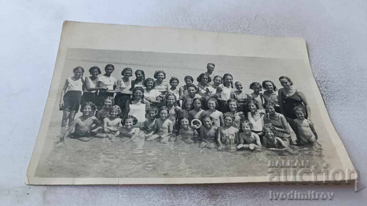 Pomorie C-class students from 2nd-b grade with their teachers in the sea