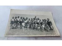 Pomorie C-class students from 2nd-b grade with their teachers in the sea