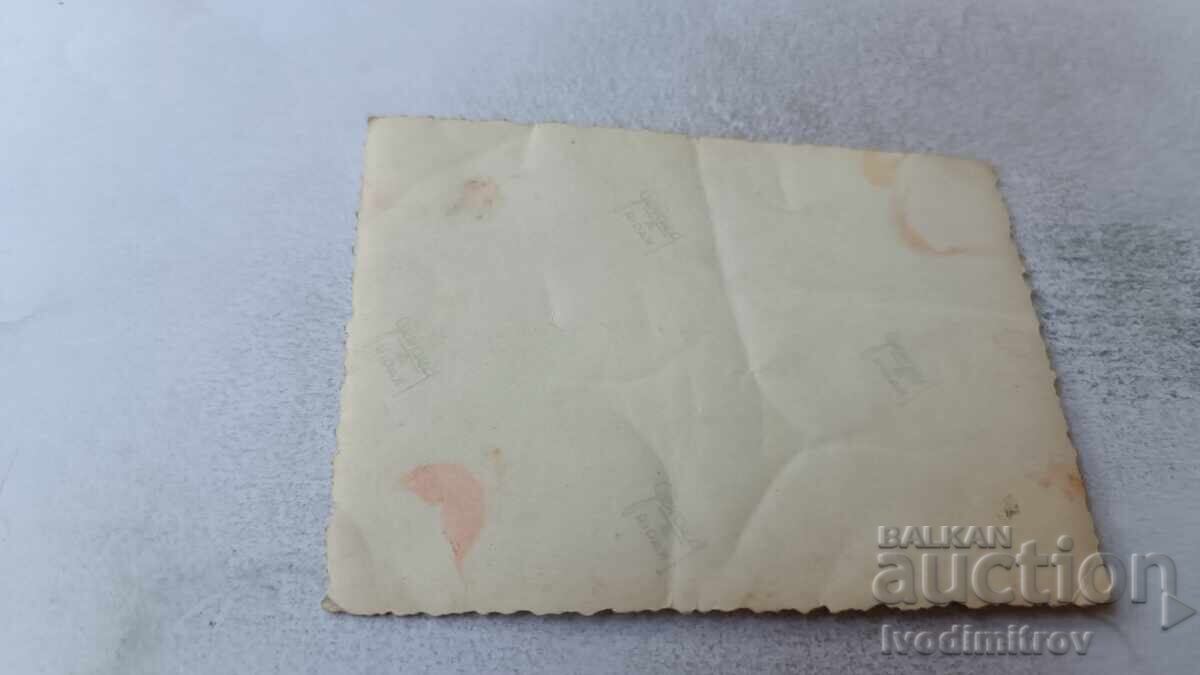 Photo of a man, woman, and little girl in front of a single-family house with price 2.45 BGN | € 1.25 Photo of a man, woman, and little girl in front of a single-family house with price 2.45 BGN | € 1.25