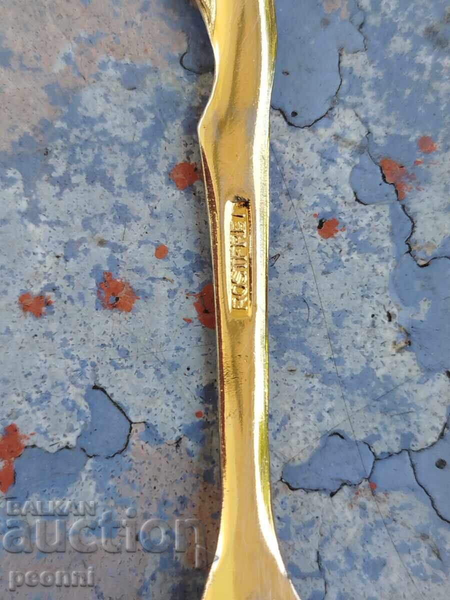 Delivery of Gilded spoon