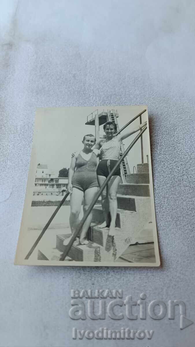 C-ka Bankya Two young girls on the steps of a swimming pool