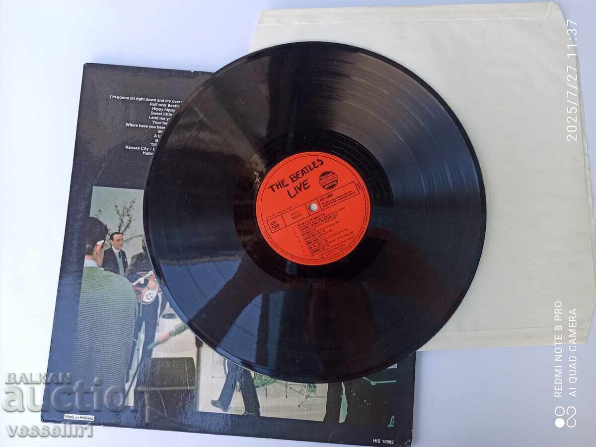 Delivery of Old gramophone record of The Beatles vinyl Beatles record