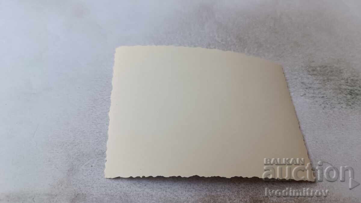 Photo: Young man sitting on a rock in the sea with price 1.85 BGN | € 0.95