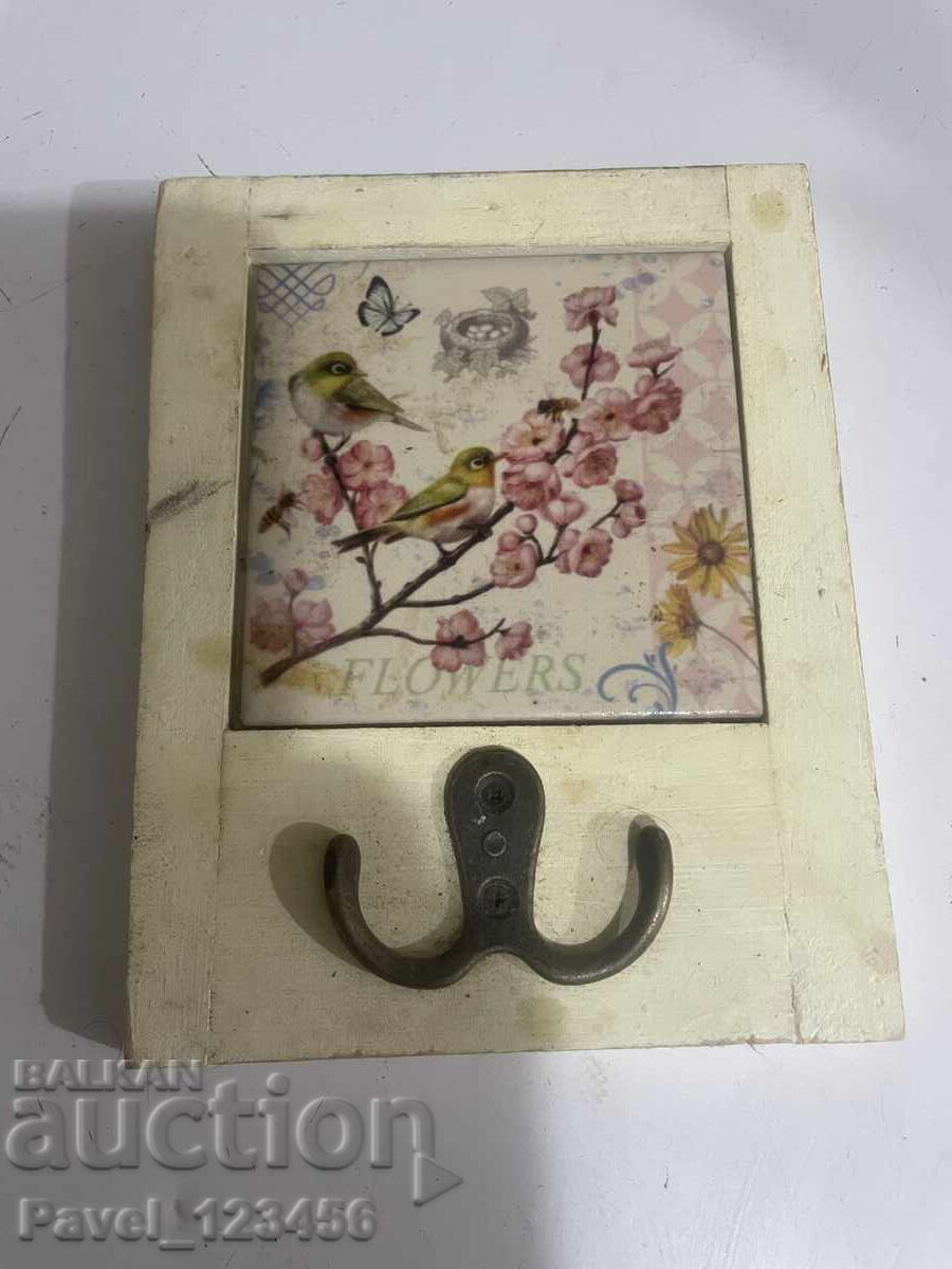 Hanger with a ceramic tile