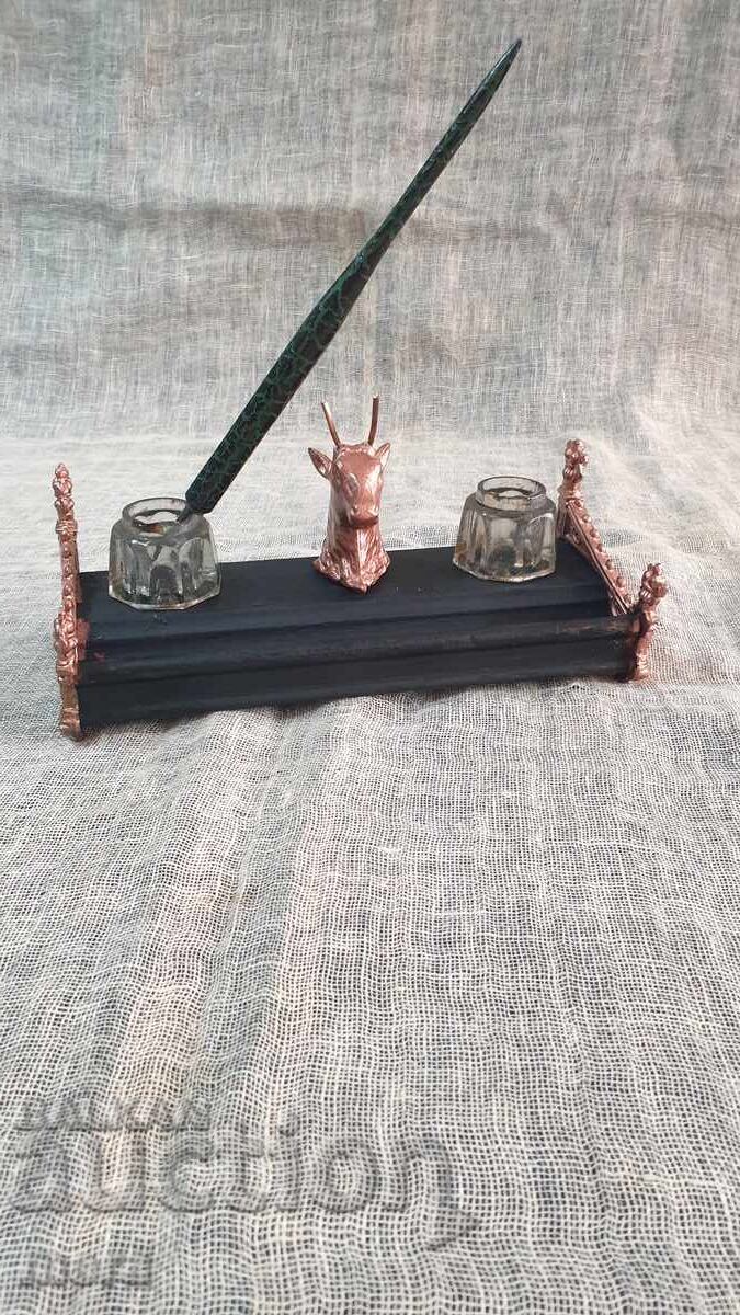 Old antique inkwell made of metal, wood and crystal