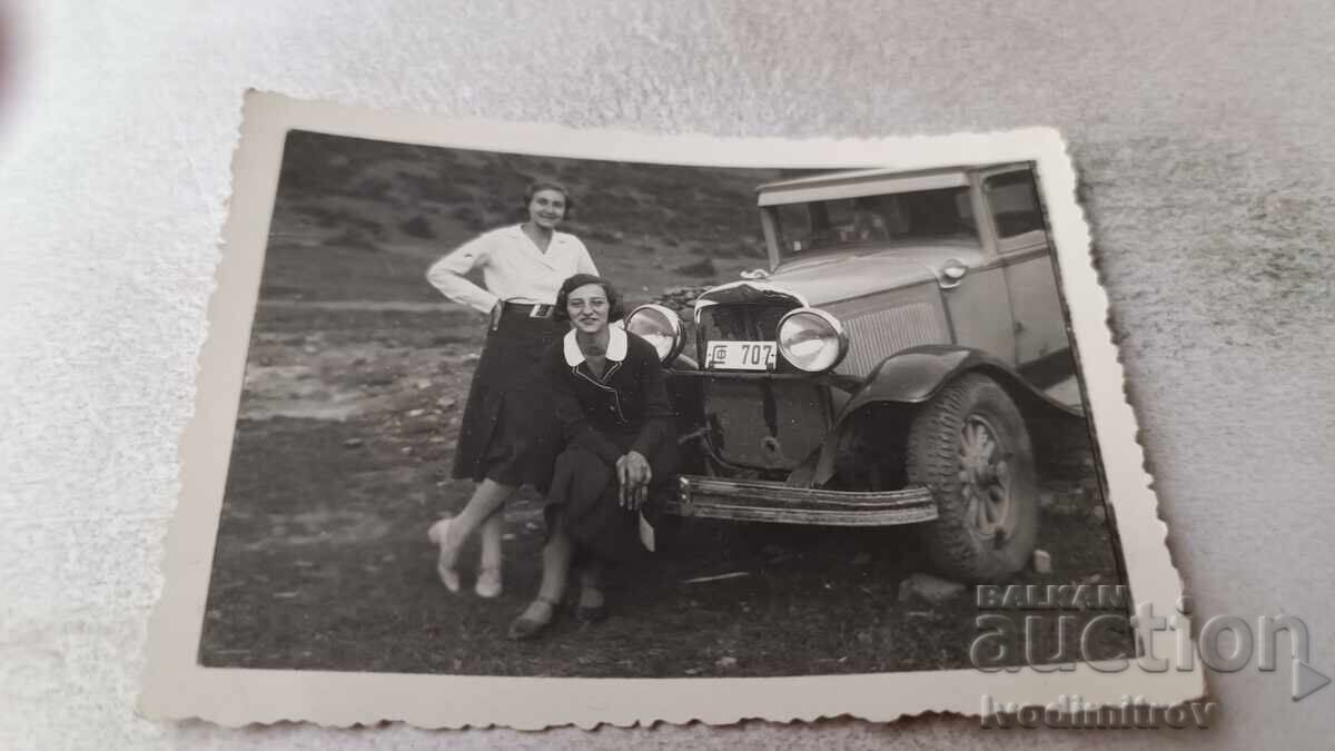 C-Class Two young girls with a retro car with registration number Sf 707