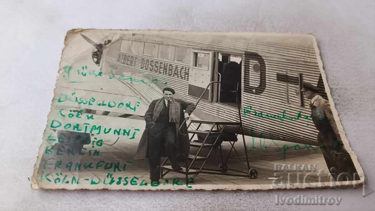 Photo of a Man by the Steps of a German Passenger Airplane Photo of a Man by the Steps of a German Passenger Airplane