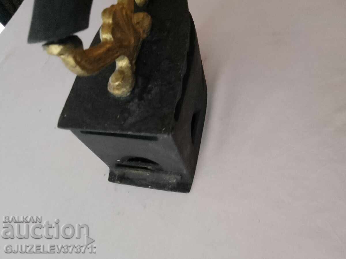 Auction  An old cast iron iron on fire