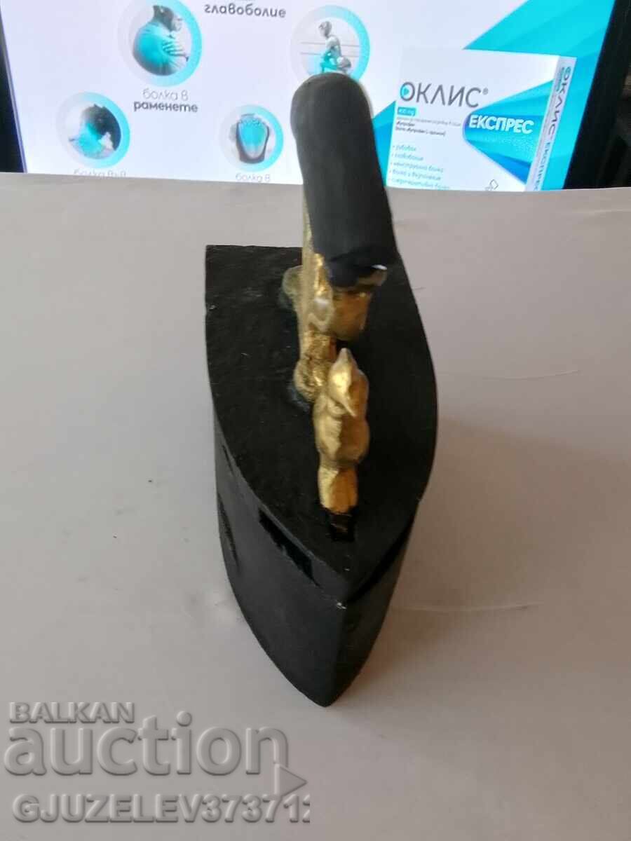 An old cast iron iron on fire - 5