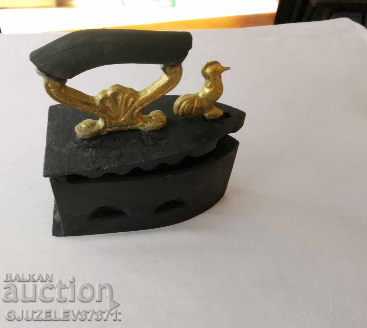 An old cast iron iron on fire - 6