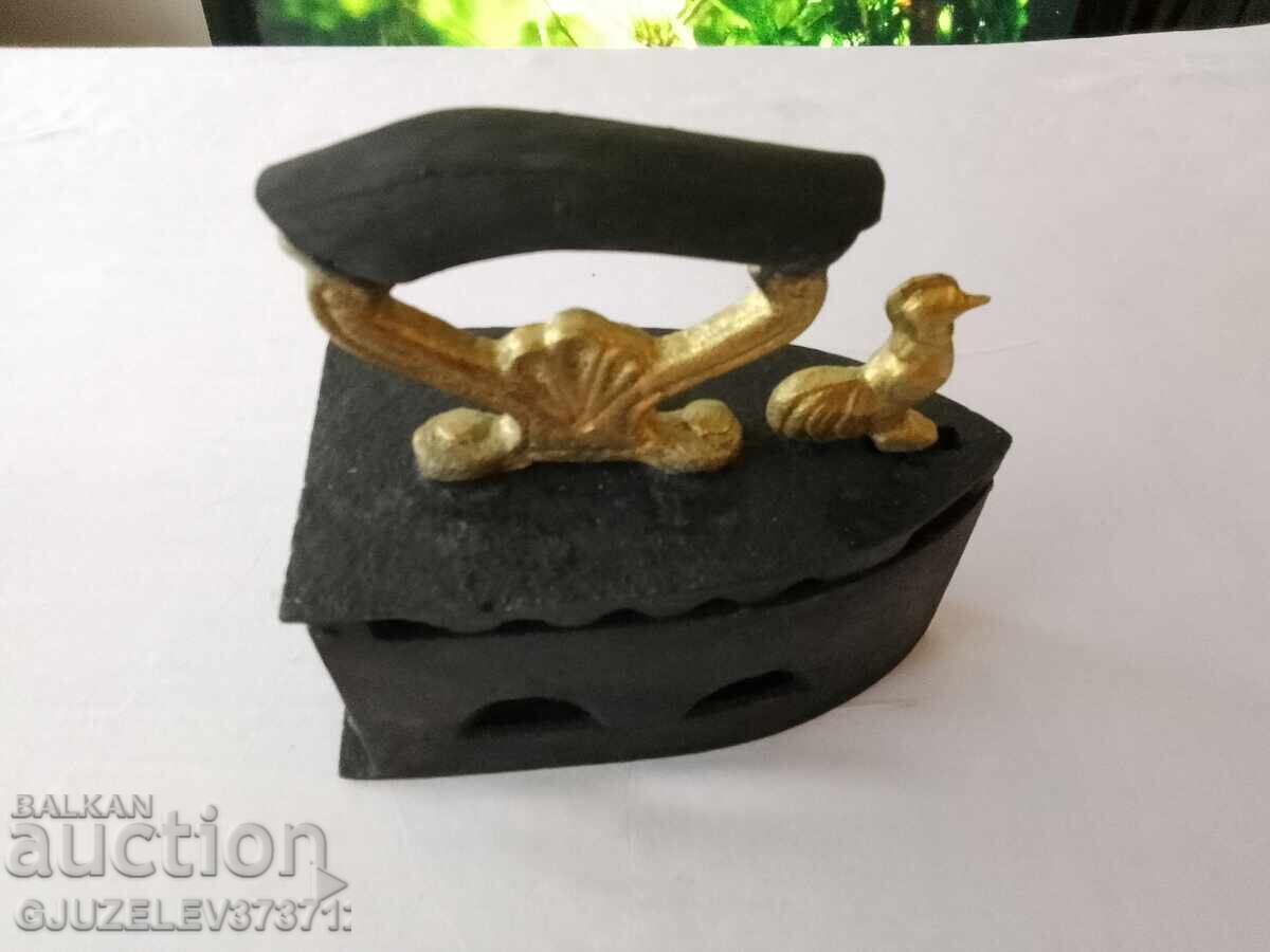 An old cast iron iron on fire - 7