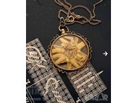 Antique silver pendant with alpine edelweiss
