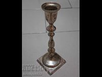 Old bronze candlestick, thickly silver-plated