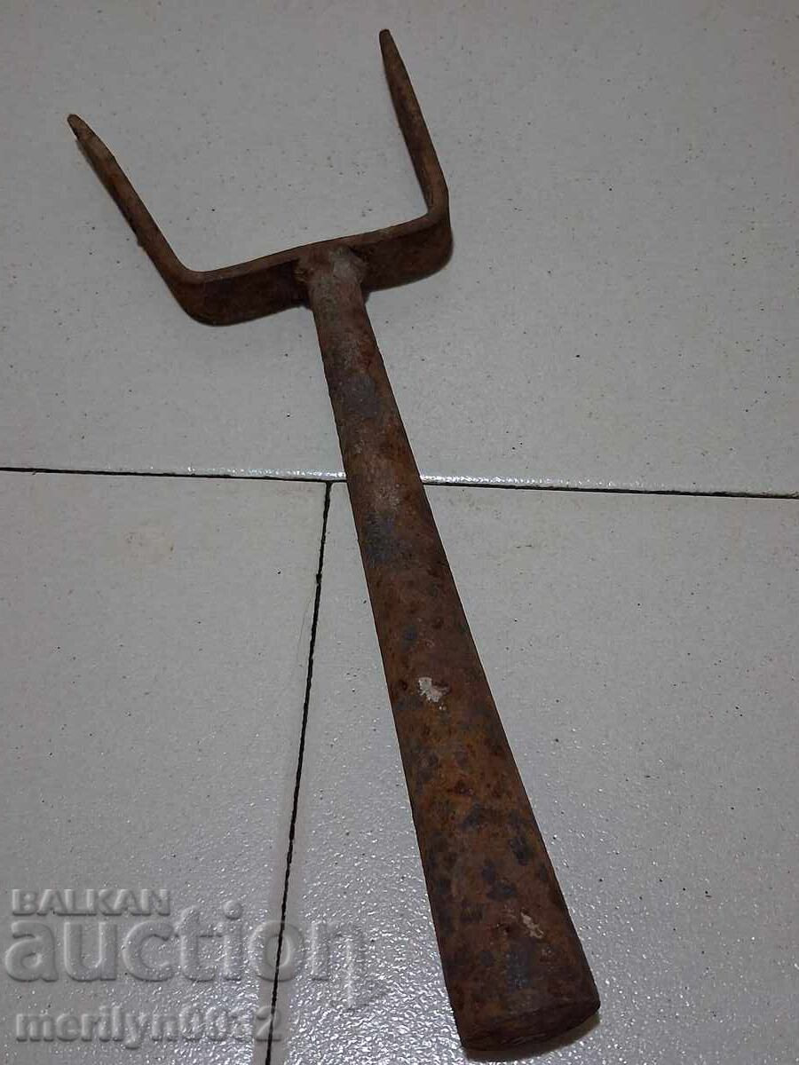 Old hand-forged anvil for hair straightening