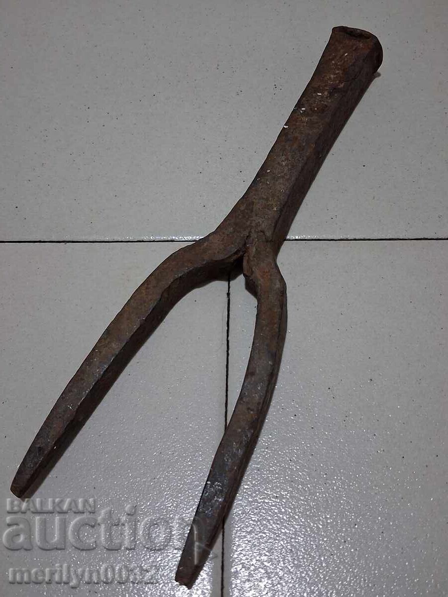 Old hand-forged anvil for hair straightening