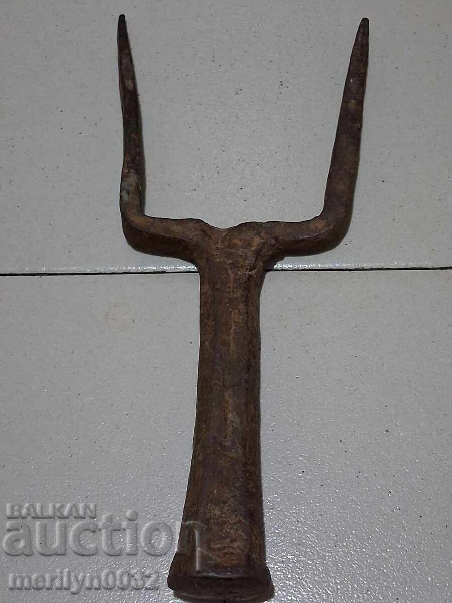 Old hand-forged anvil for hair straightening