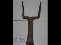 Old hand-forged anvil for hair straightening