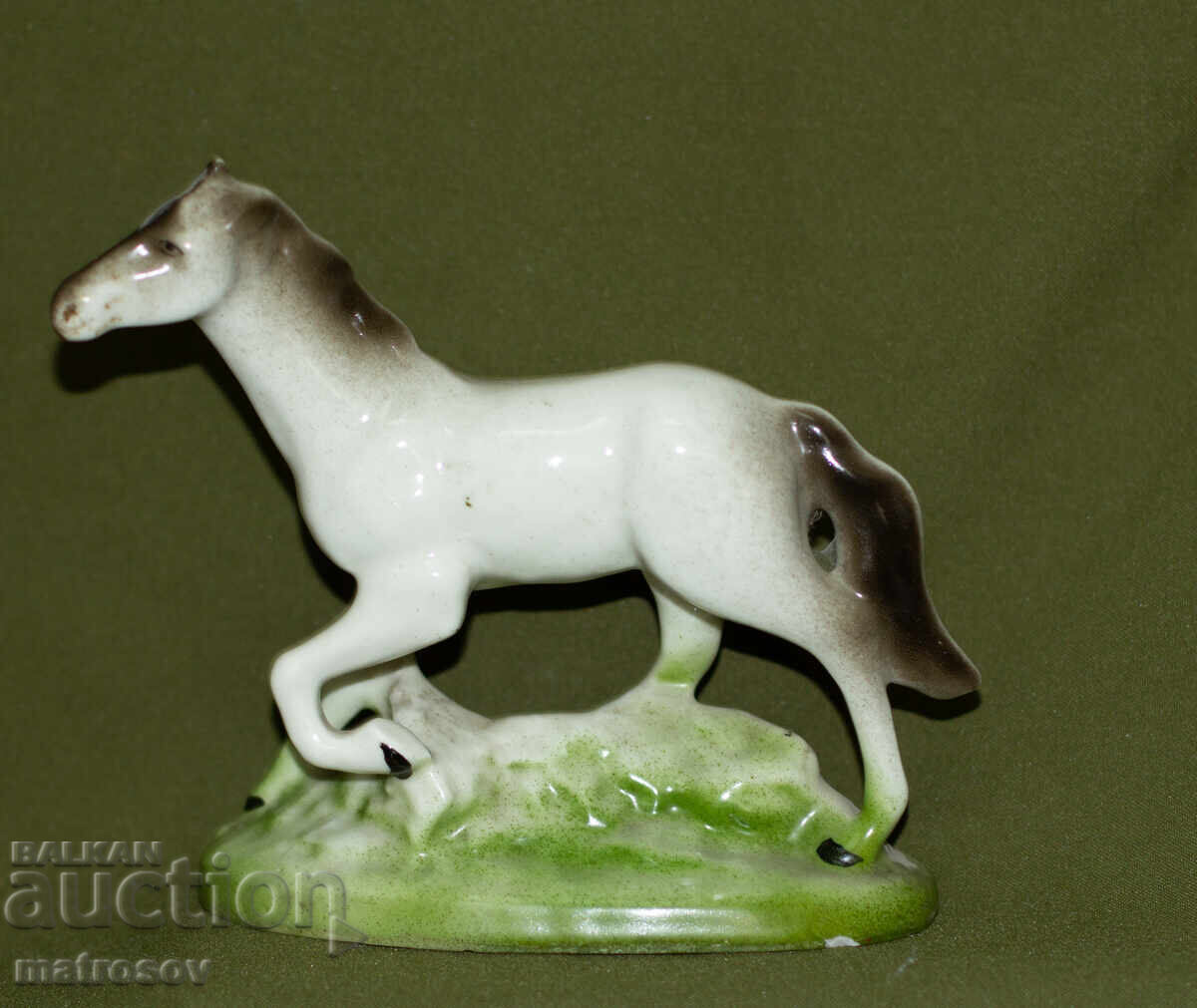 Decorative porcelain figurine of a white stallion