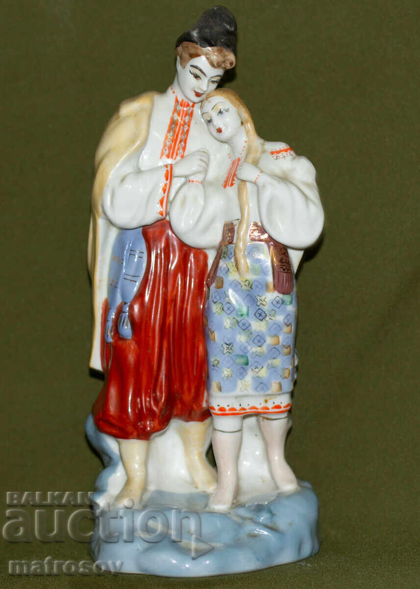 Auction  Old Russian porcelain folklore figurine of a man and woman