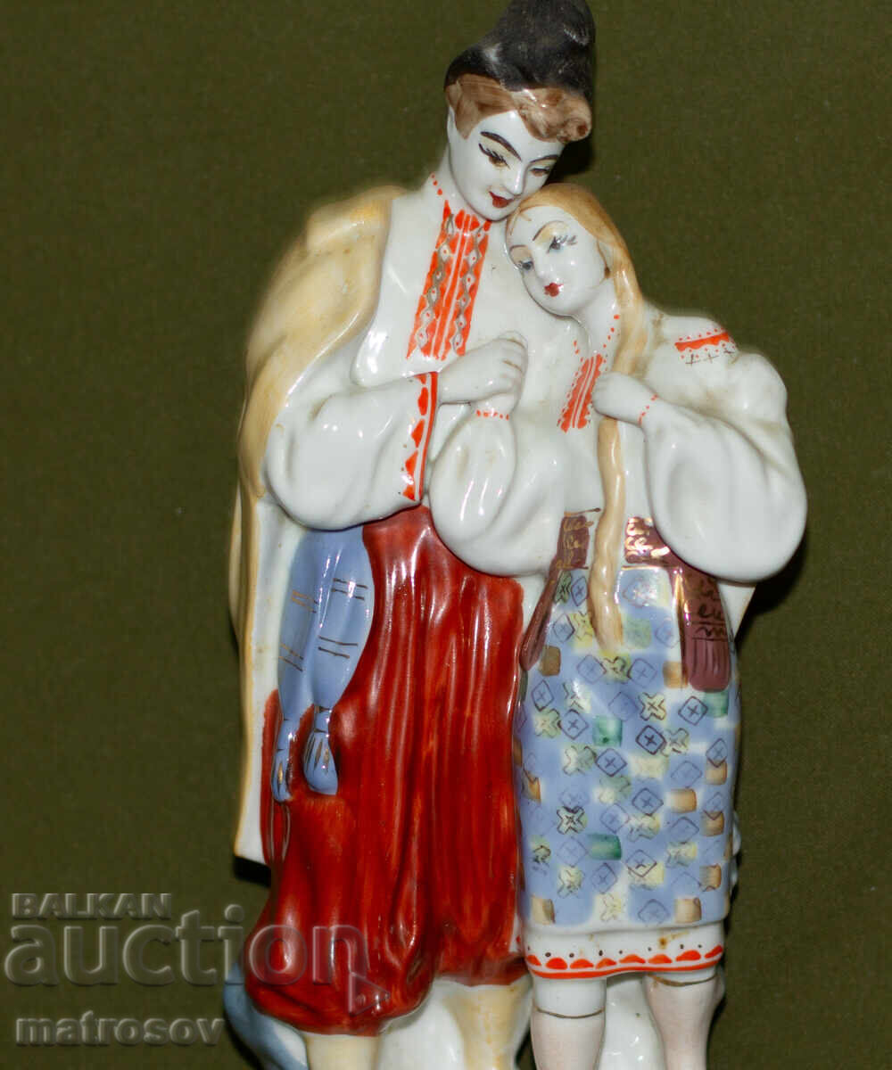 Old Russian porcelain folklore figurine of a man and woman