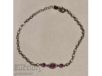 Delicate silver bracelet with small pink and white zircons. 925