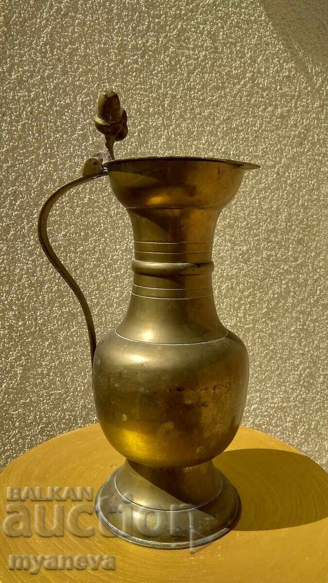 Large, metal jug with a lid, decorated with hazelnuts