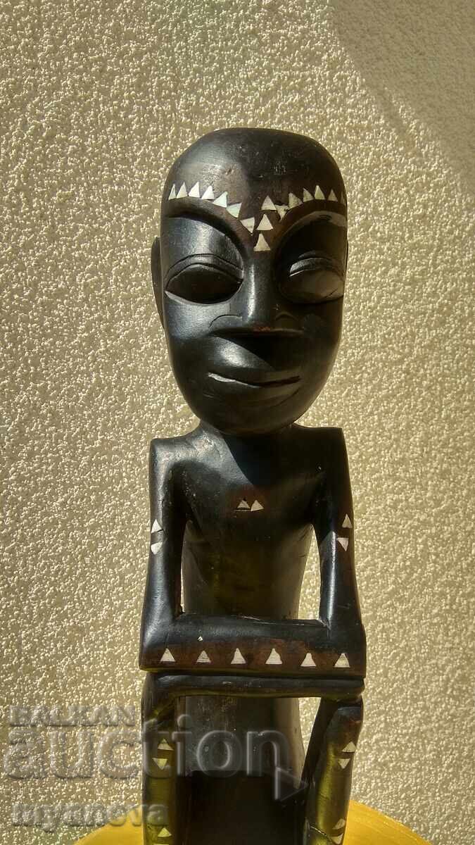 Auction  African, hand-carved wood carving with mother-of-pearl