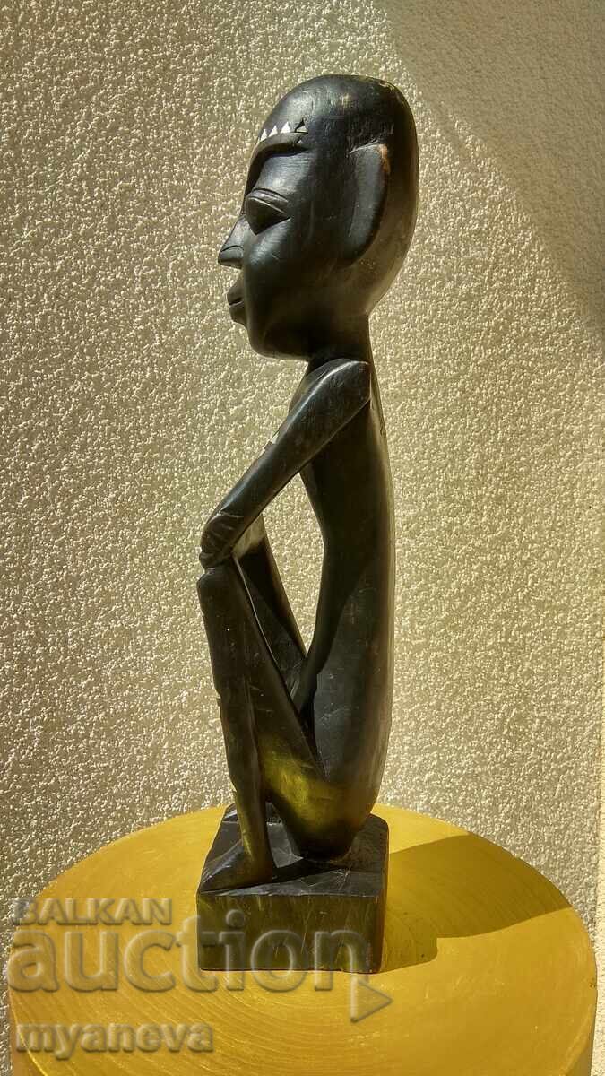 Delivery of African, hand-carved wood carving with mother-of-pearl