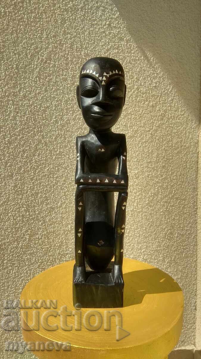 African, hand-carved wood carving with mother-of-pearl
