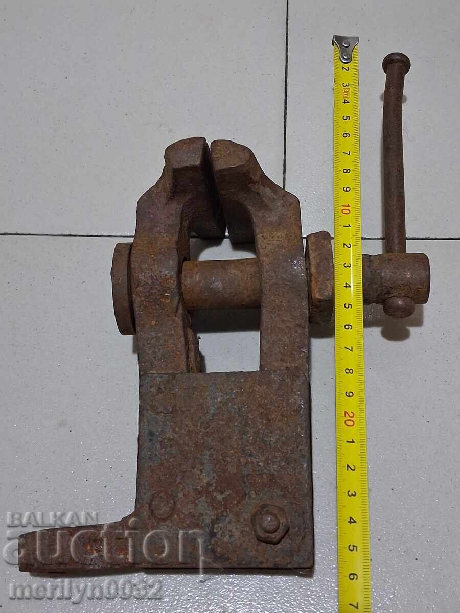An old vise clamps a blacksmith's tool - 5
