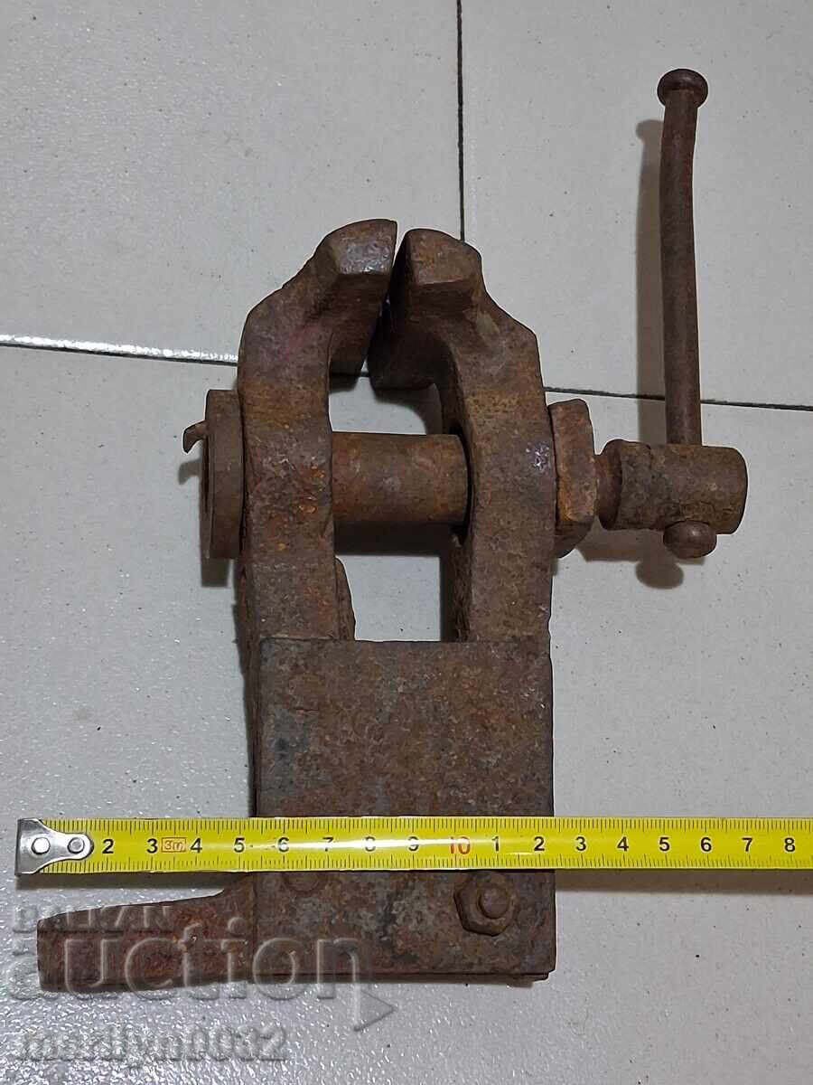 An old vise clamps a blacksmith's tool - 6