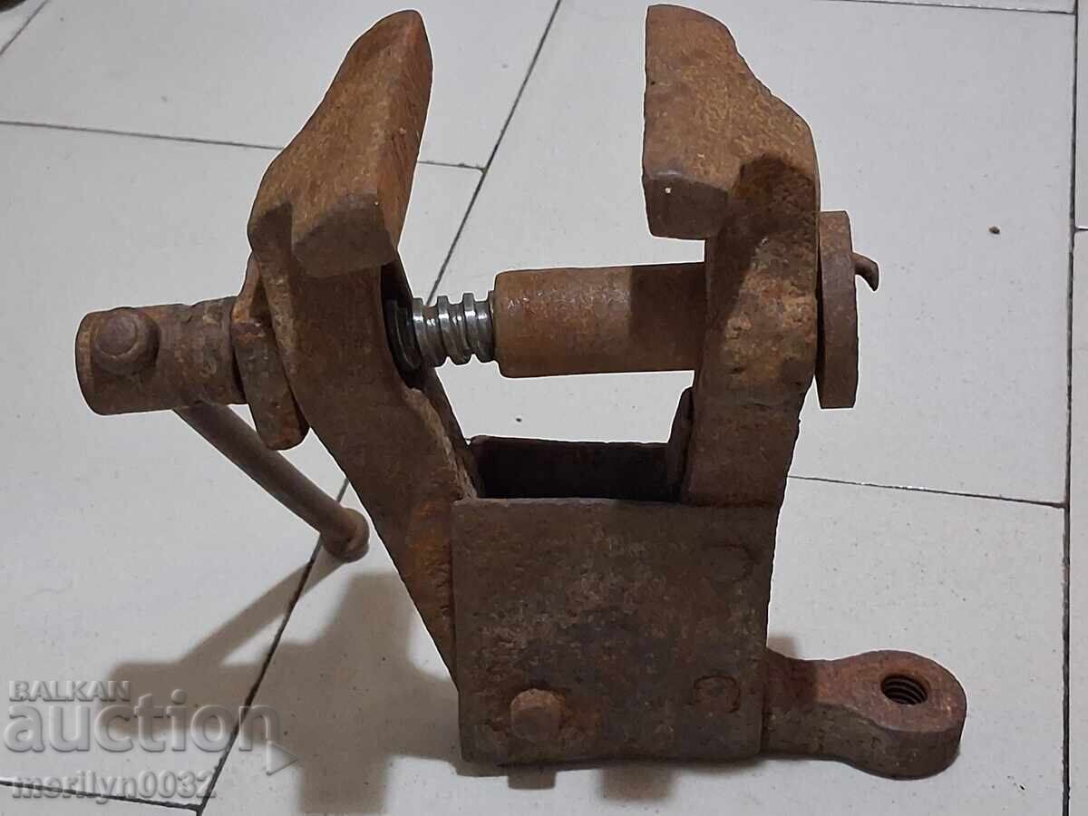An old vise clamps a blacksmith's tool - 7